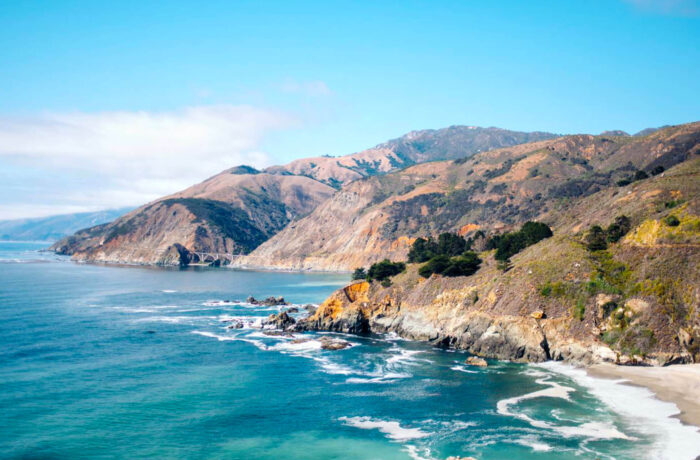 View of coastline with hills on the ocean